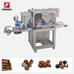 MACHINE À DOSER LES CHOCOLATS ET LES PRALINES